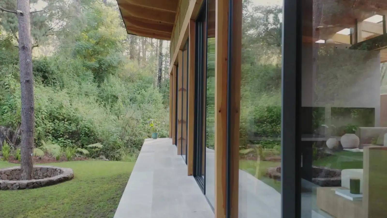 Floor-to-ceiling bespoke glass corridor installed by Evolution Glazing in a Coquitlam home near Vancouver